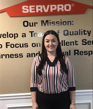Female SERVPRO Employee Standing in front of wall
